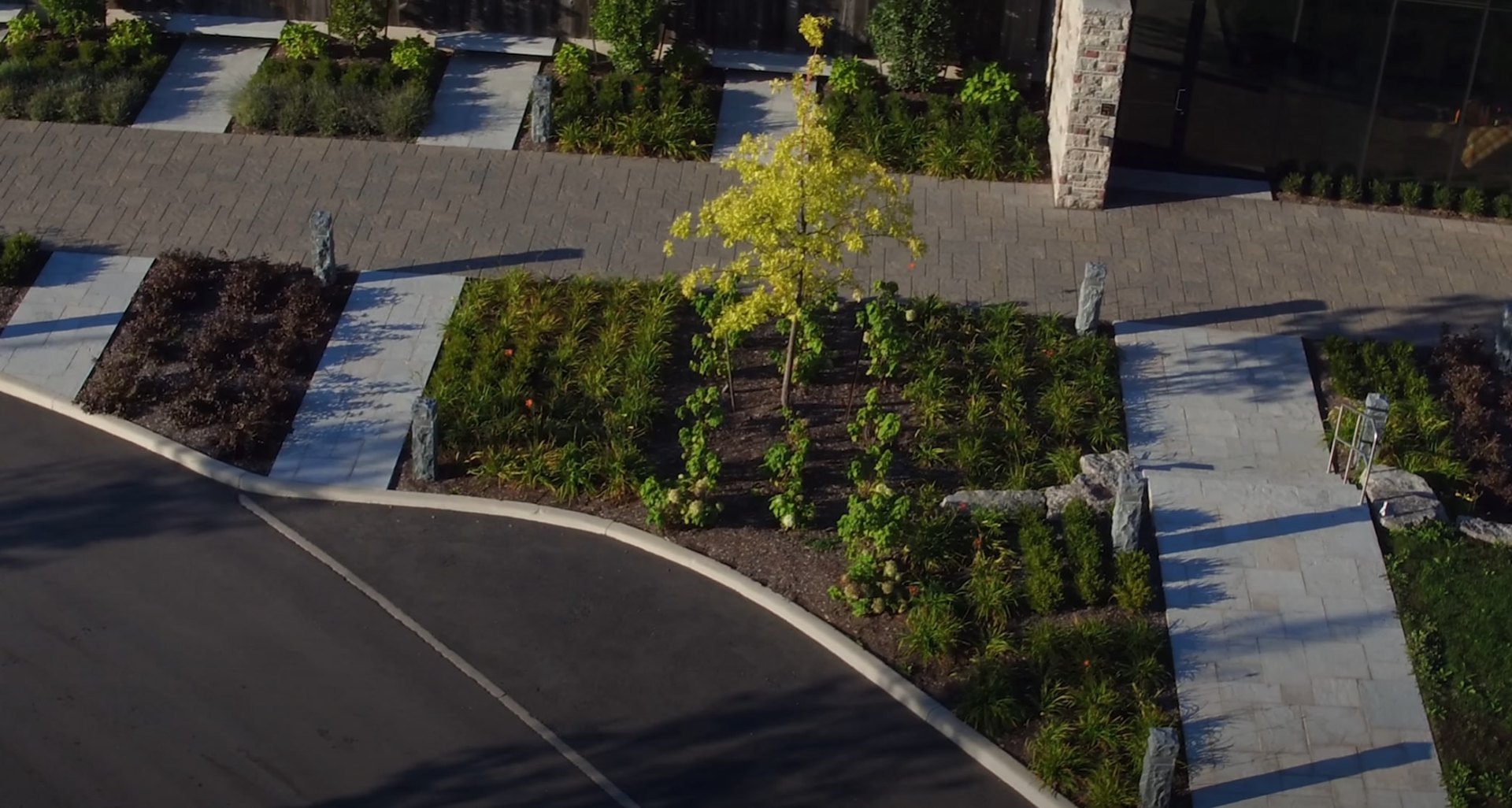 Comprehensive landscaping services including design and installation Aerial view of modern landscaping with geometric patterns and plantings